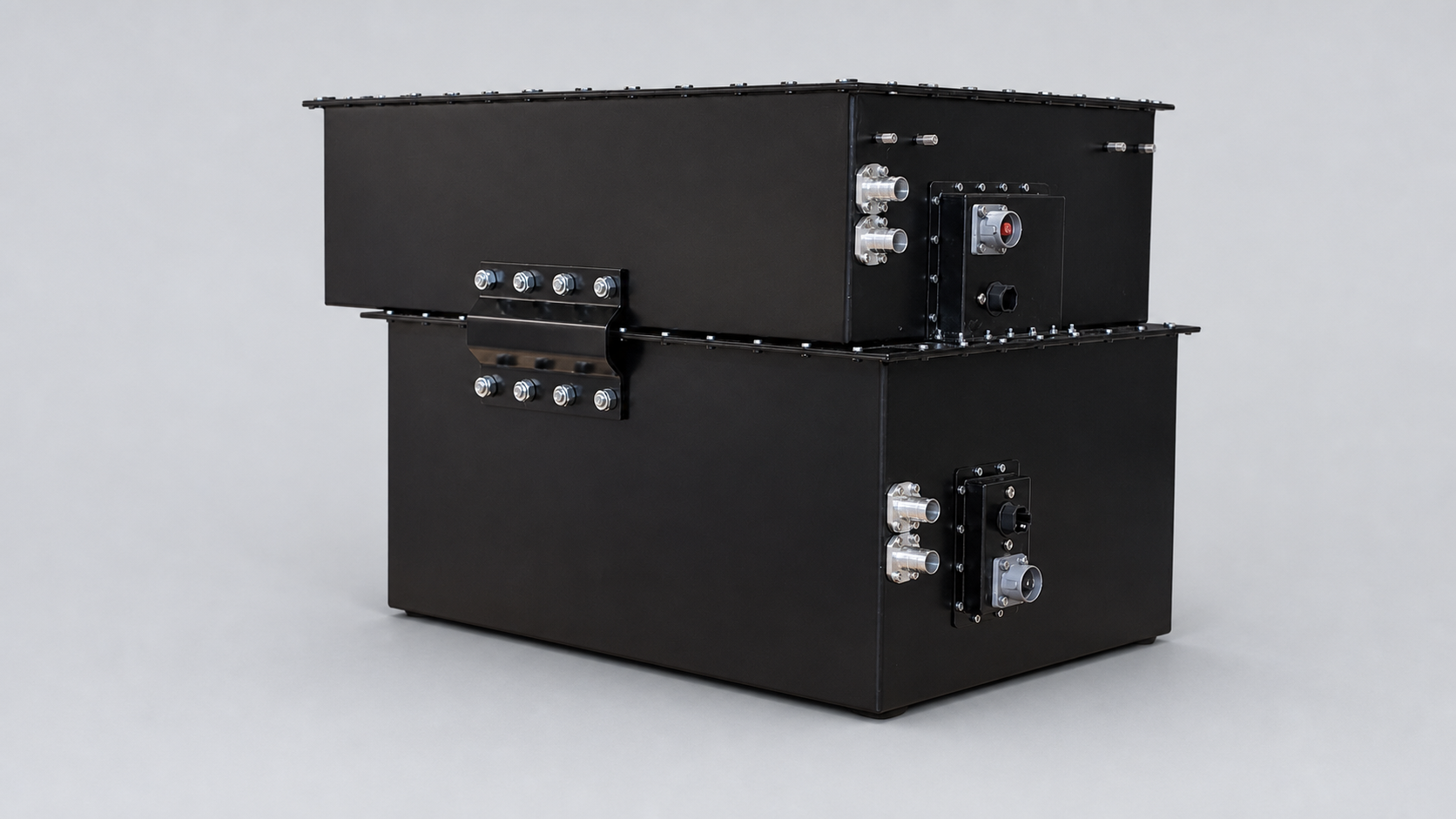 Two completed custom EVDrive battery enclosures prepared as a repeatable production-ready system